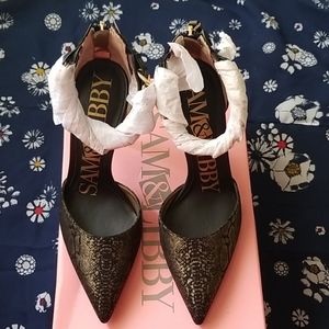 Black and gold heels